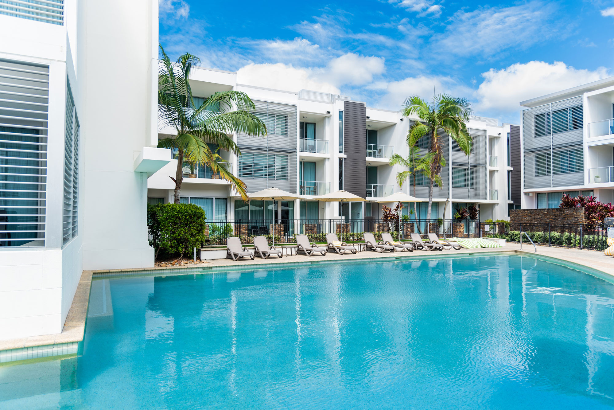 Comp Suite casino hotel exterior and pool terrace